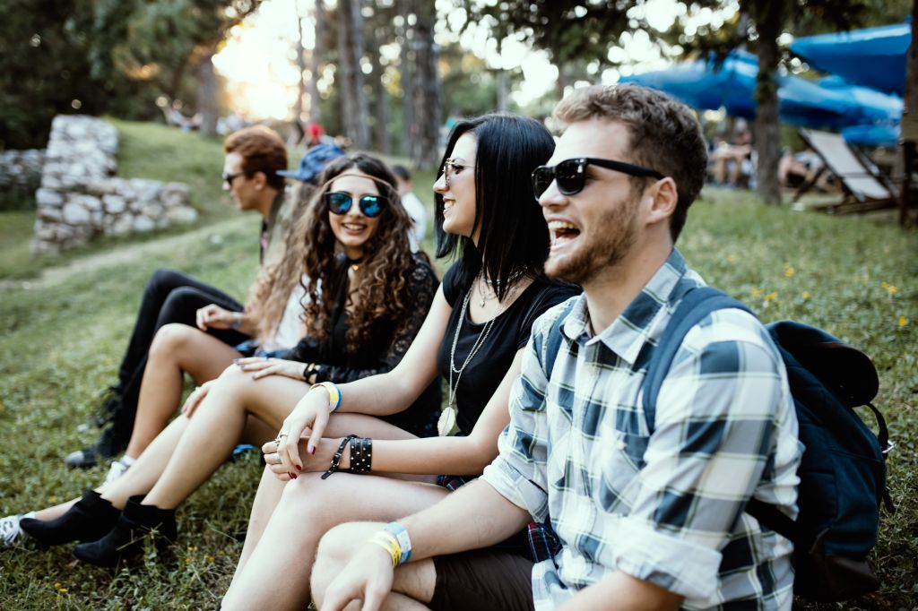 A singing group of people impatiently waiting for music festival to start. Friendship concept. depth of view