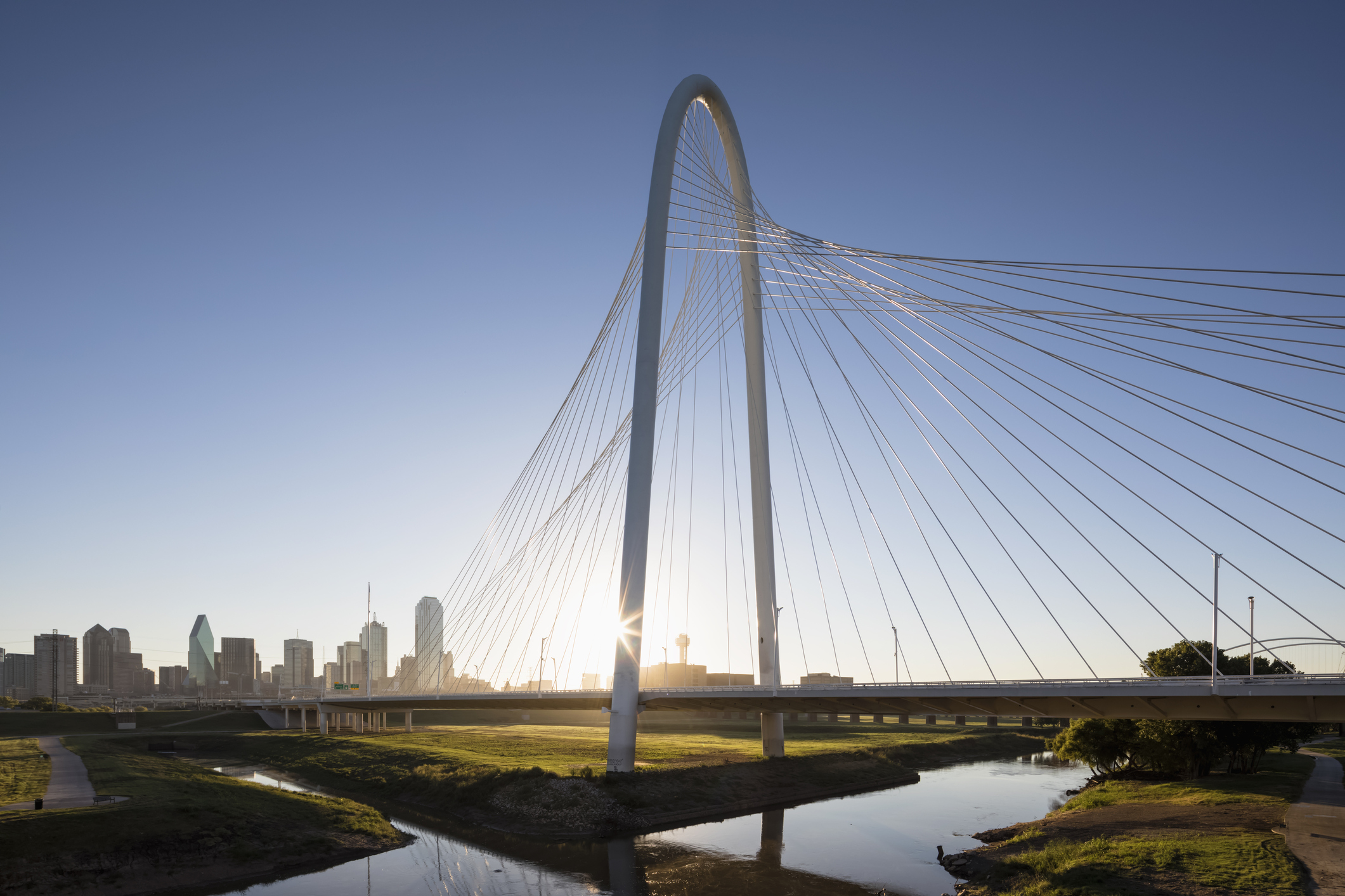 USA, Texas, Dallas, Margaret Hunt Hill Bridge and skyline at sunrise
