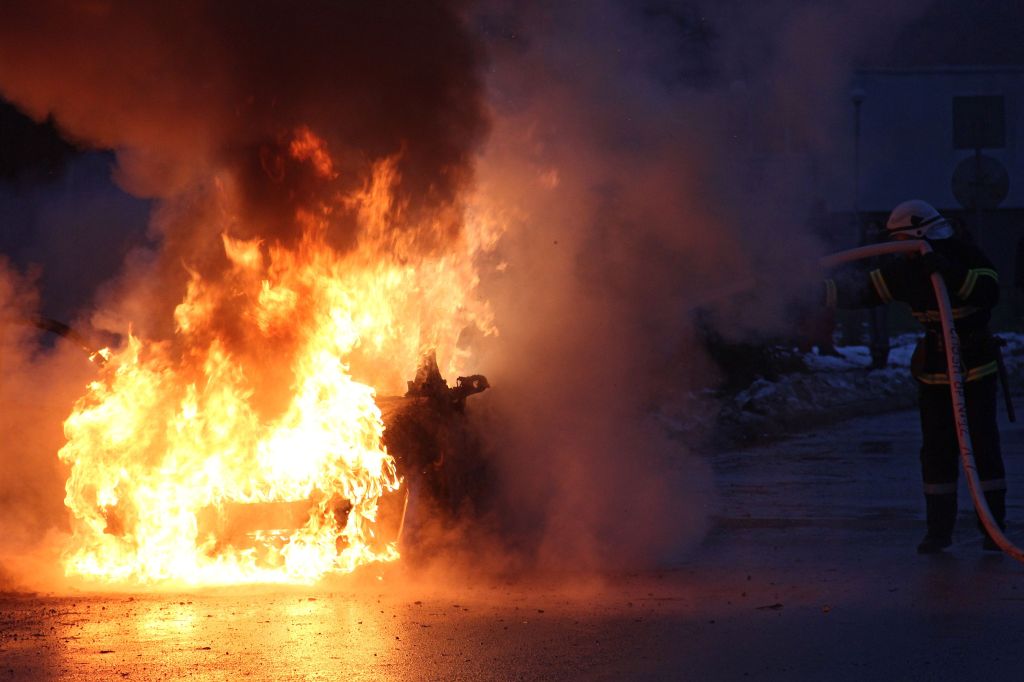 Bulgarian firefighters work hard to put out a massive fire from a burning car
