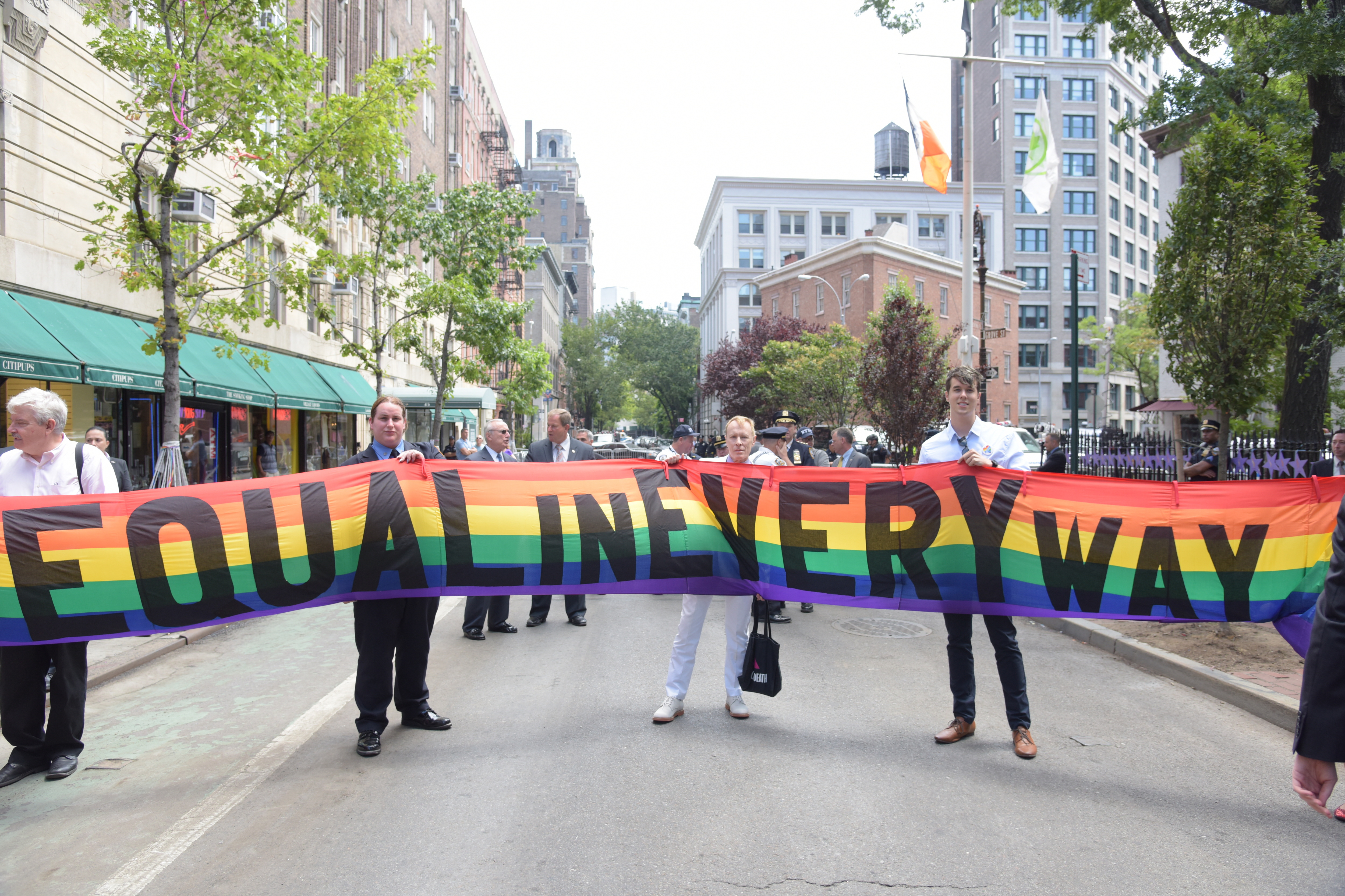 'Equal In Every Way' banner on Christopher Street. Mayor...