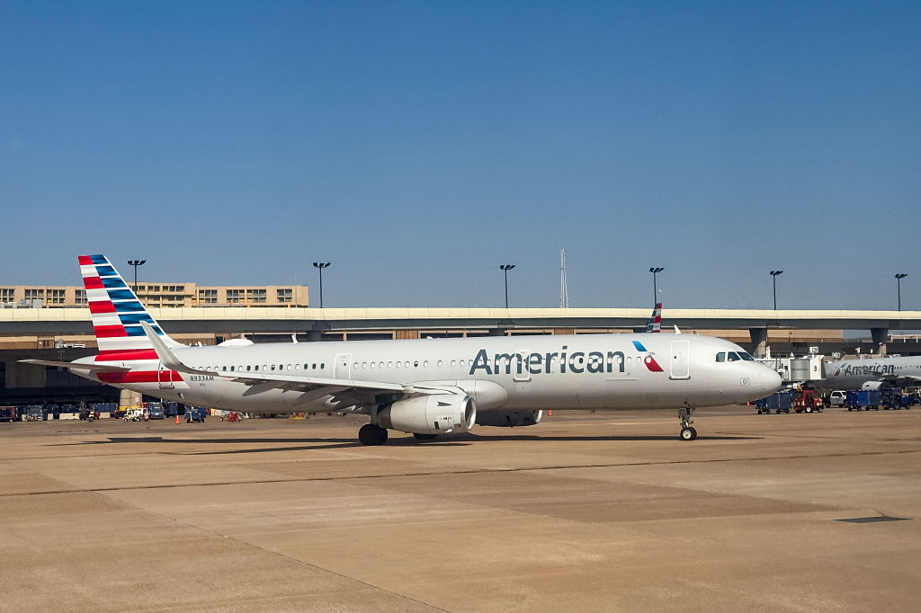 An airliner leaving the terminal at Dallas-Fort Worth International AIrport, Texas